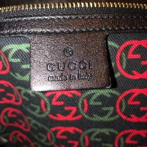 Gucci with gold logo.
